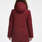 Manteau d'hiver mi-long pour femme. Manteau d'hiver fait au Québec, fait à partir de tissu haute performance. Manteau Imperméable, manteau coupe-vent et manteau respirant. Isolant synthétique et vegan. Manteau chaud bourgogne.