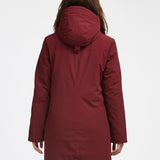 Manteau d'hiver mi-long pour femme. Manteau d'hiver fait au Québec, fait à partir de tissu haute performance. Manteau Imperméable, manteau coupe-vent et manteau respirant. Isolant synthétique et vegan. Manteau chaud bourgogne.